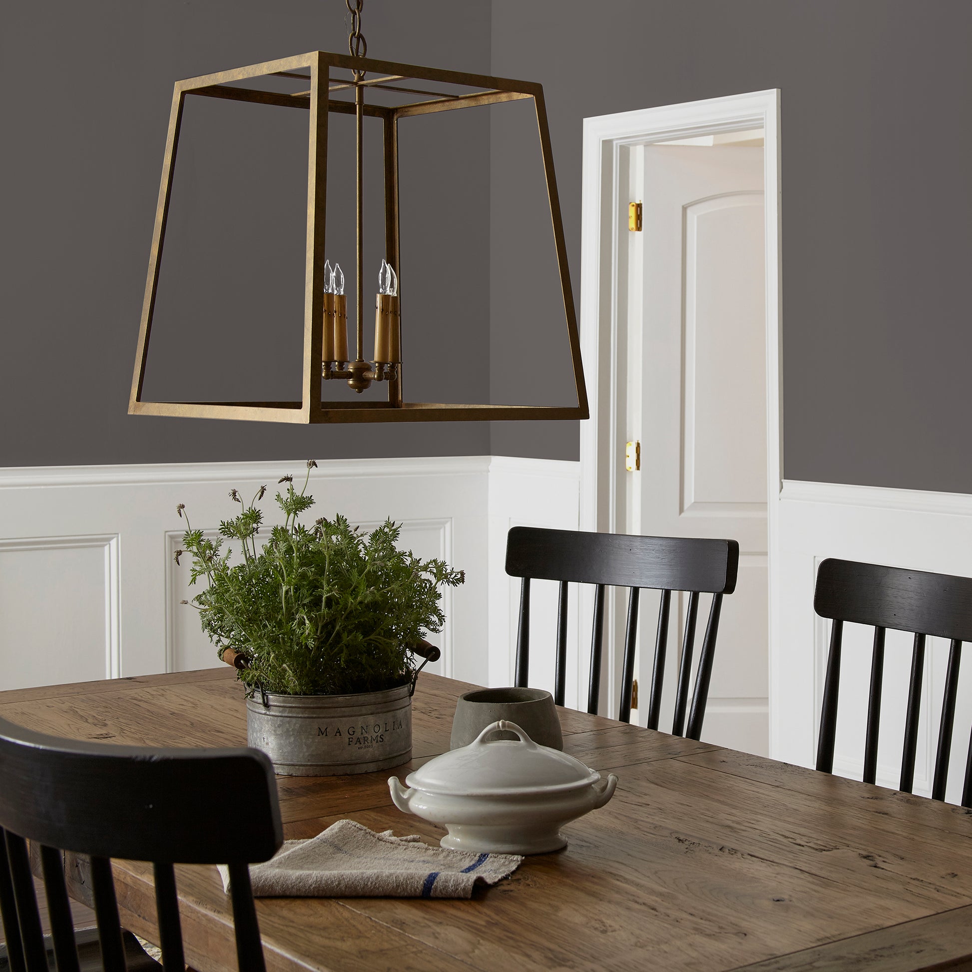 Deep brown with wine and beet red hues interior paint named pecan grove shown painted on dining room wall