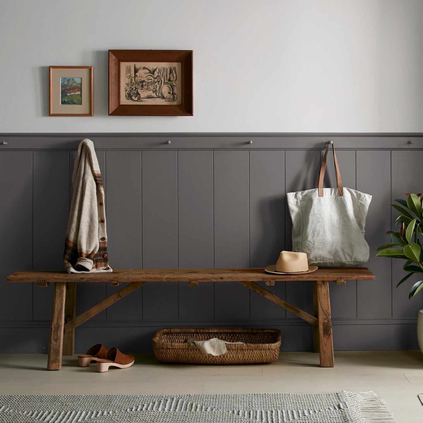 Deep brown with wine and beet red hues interior paint named pecan grove shown painted on entryway wall