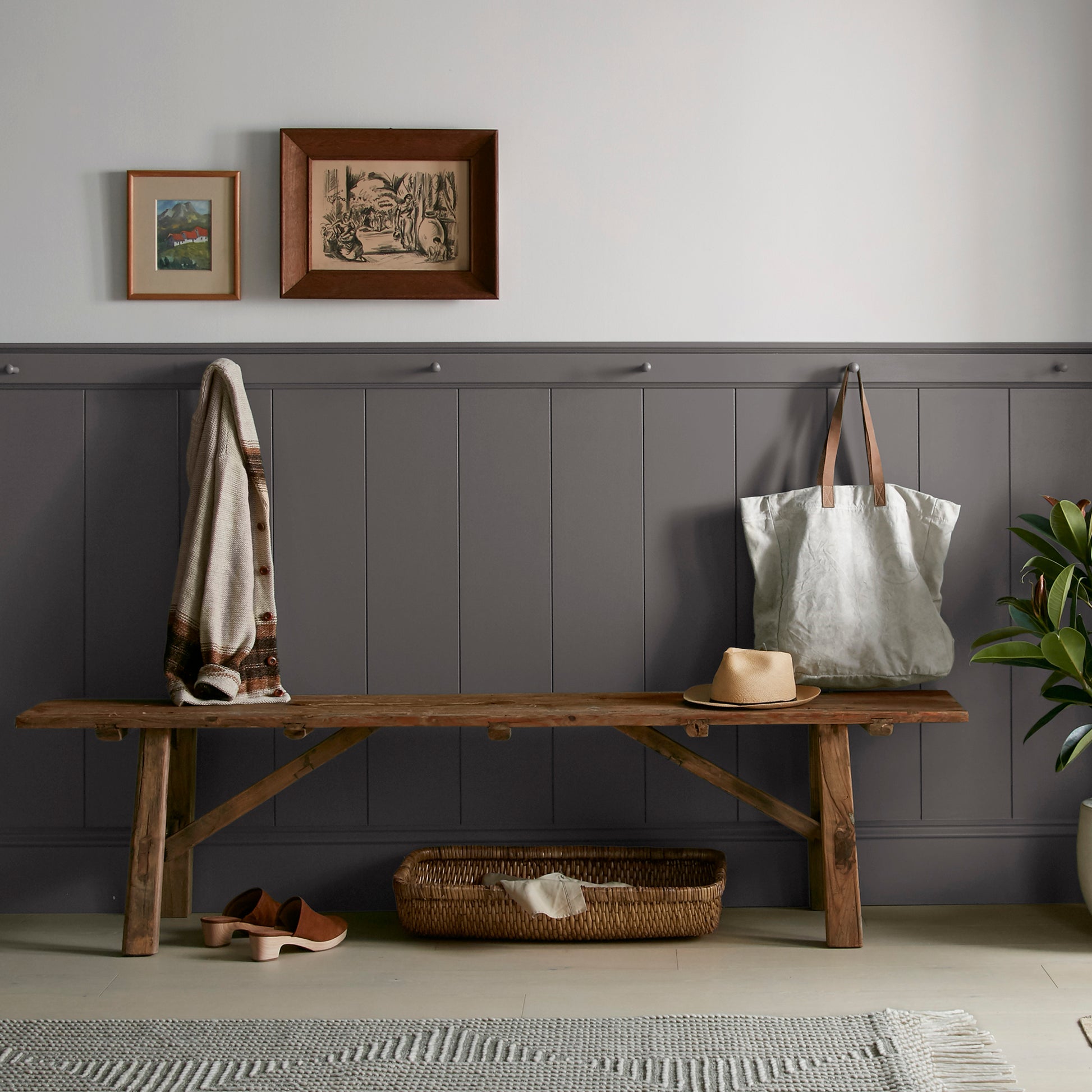 Deep brown with wine and beet red hues interior paint named pecan grove shown painted on entryway wall