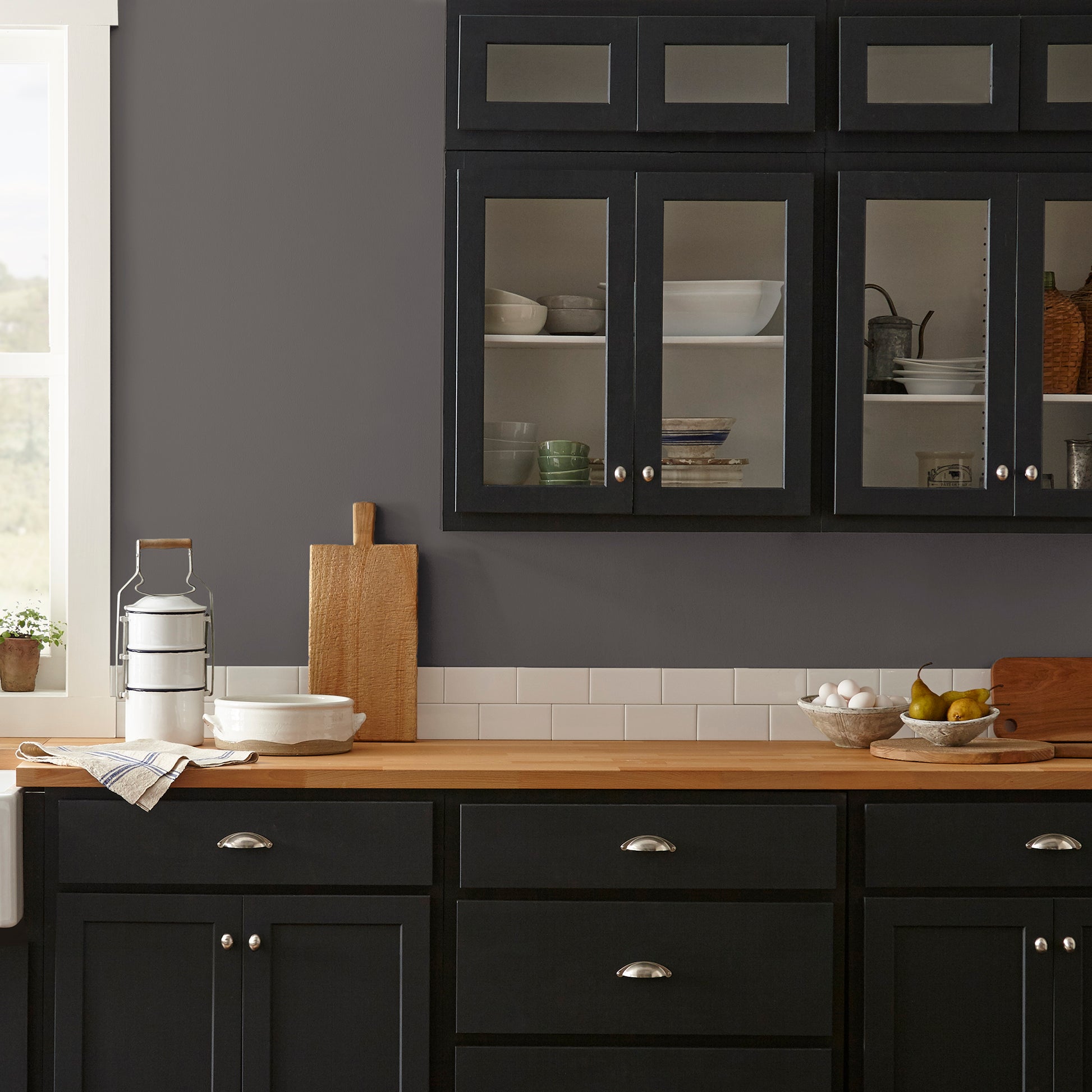 Deep brown with wine and beet red hues interior paint named pecan grove shown painted on kitchen wall