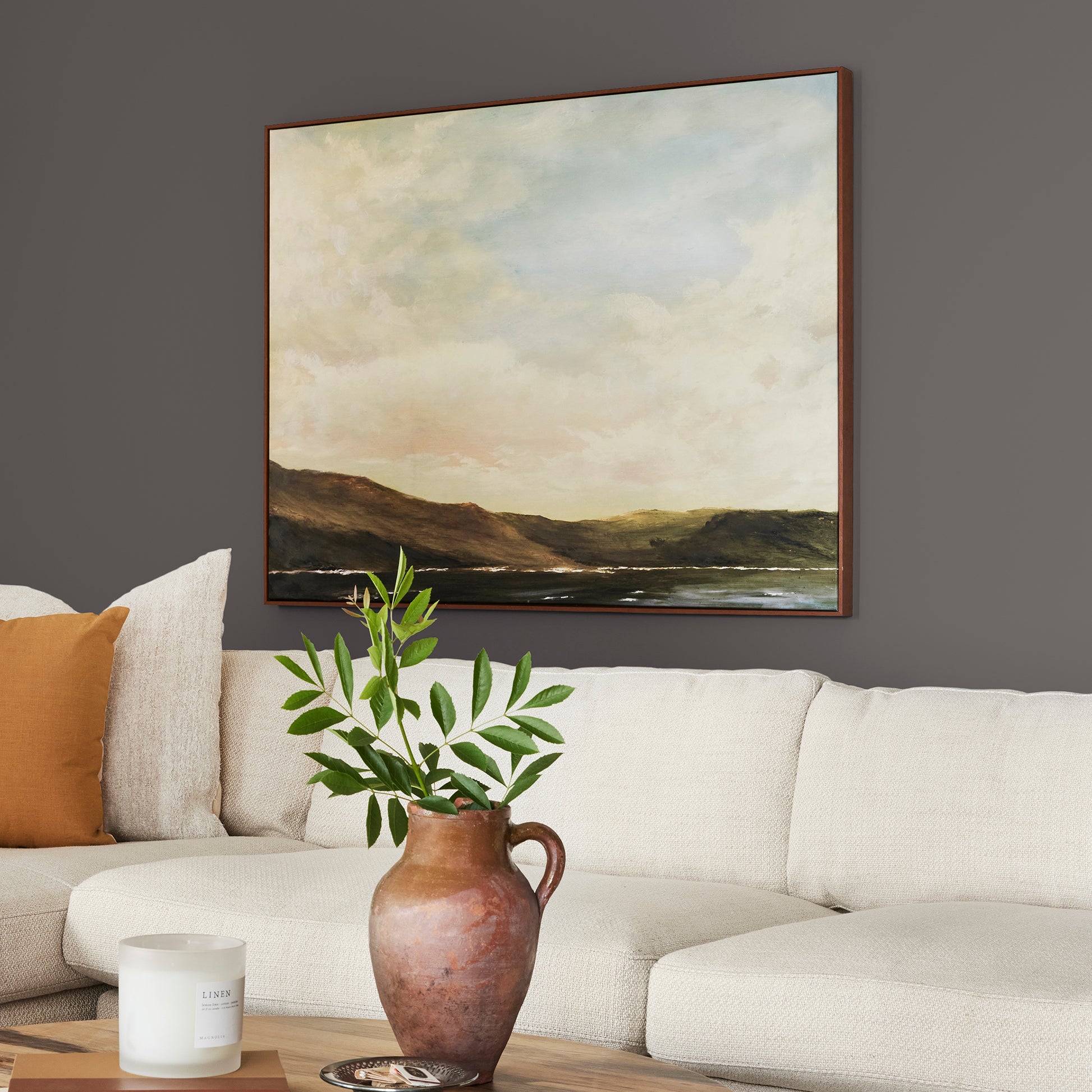 Deep brown with wine and beet red hues interior paint named pecan grove shown painted on living room wall