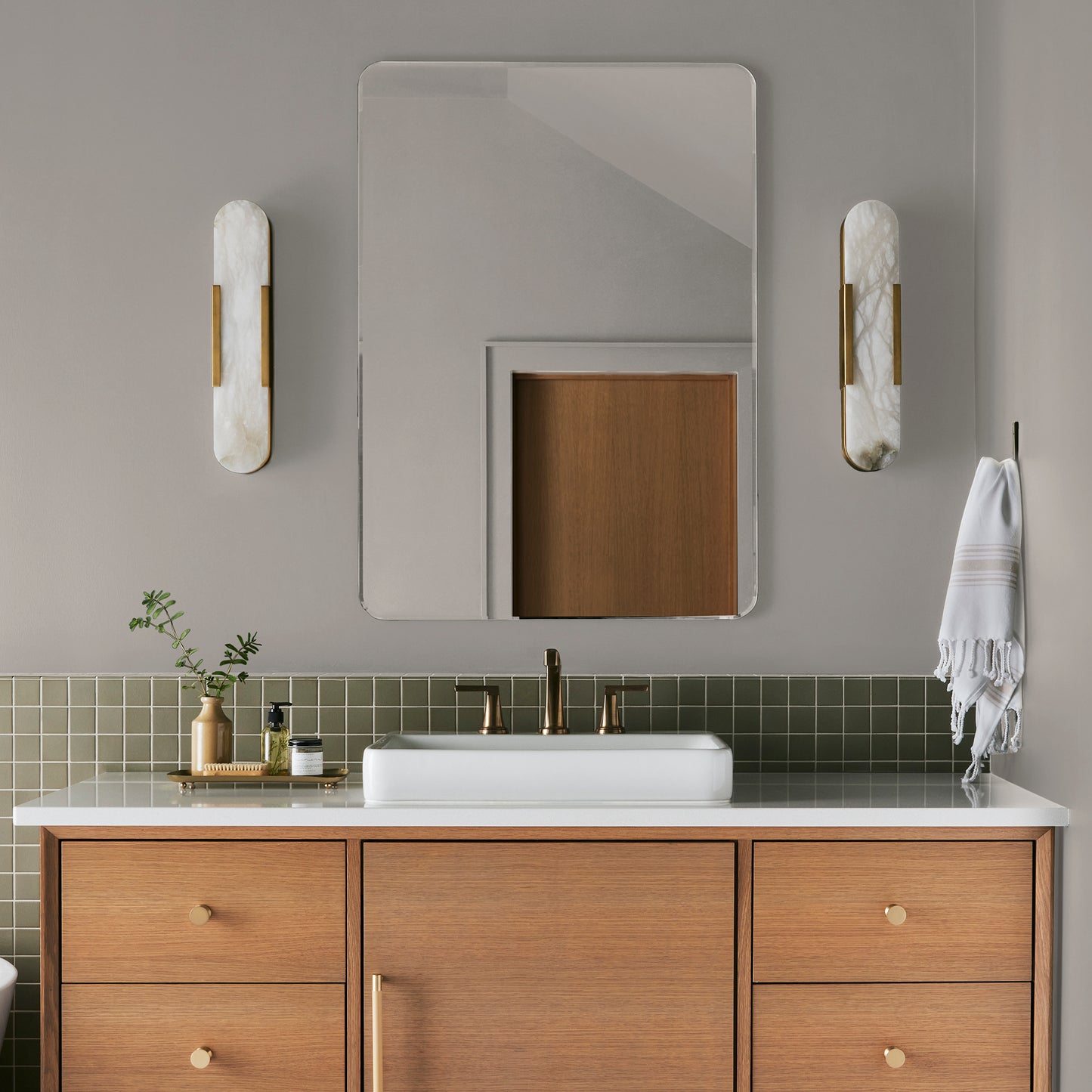 Soft tan with notes of gray interior paint named anatolian shown painted on bathroom wall