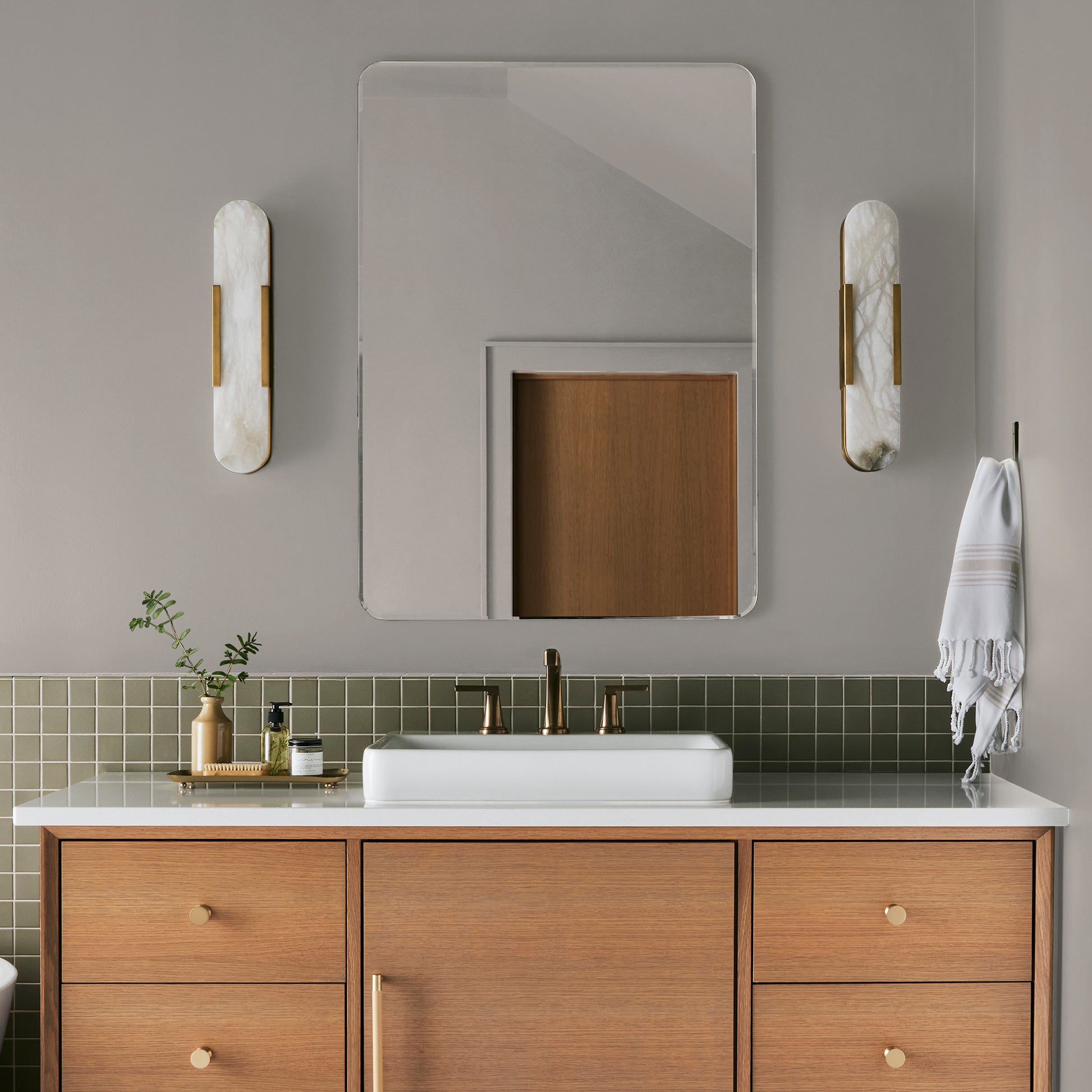 Soft tan with notes of gray interior paint named anatolian shown painted on bathroom wall