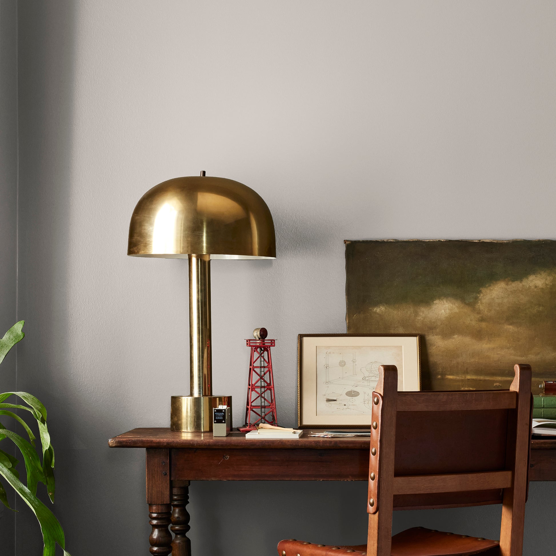 Soft tan with notes of gray interior paint named anatolian shown painted on bedroom wall