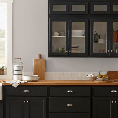 Soft tan with notes of gray interior paint named anatolian shown painted on kitchen wall