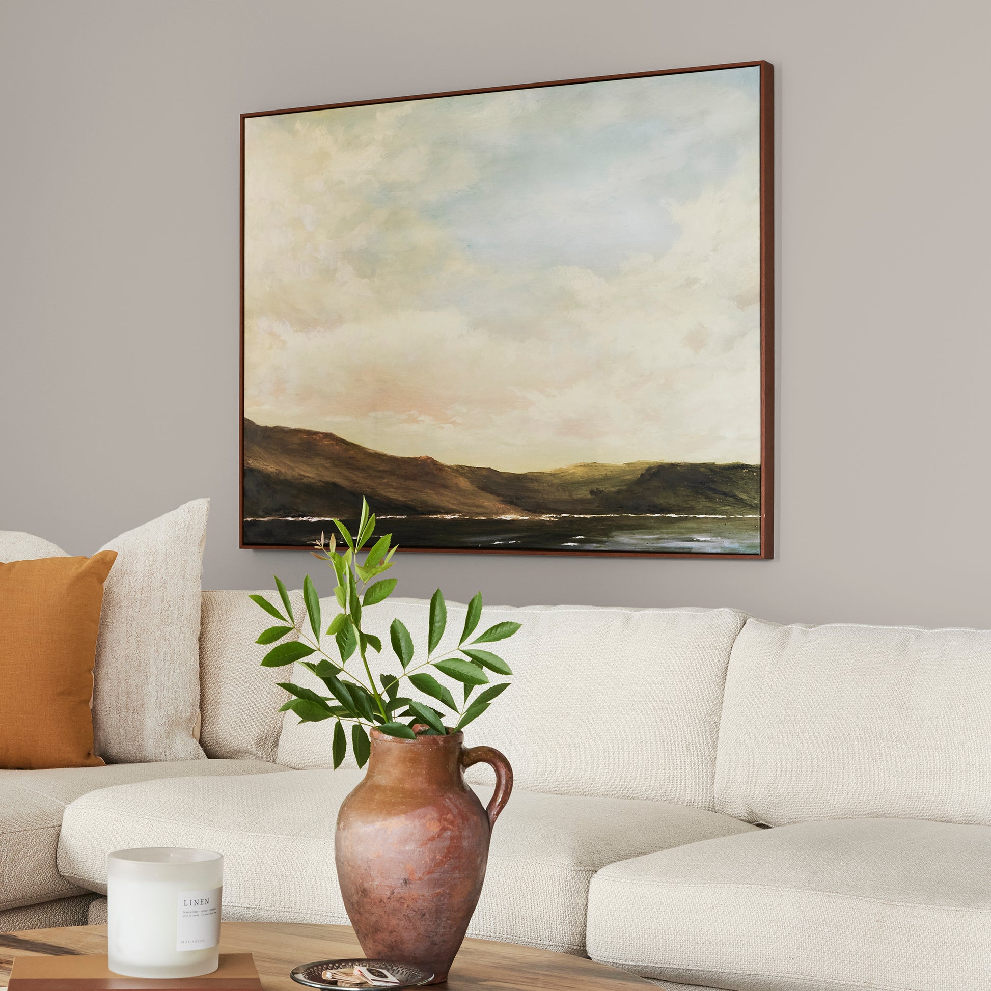 Soft tan with notes of gray interior paint named anatolian shown painted on living room wall