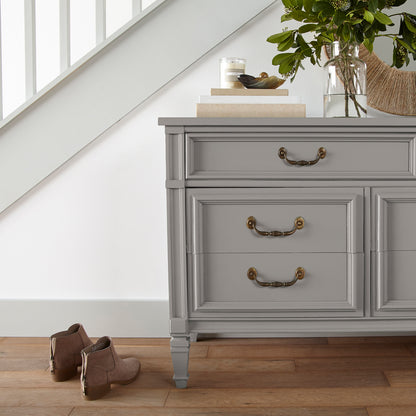 Muted gray with lavender hues door and cabinet paint named watering can shown painted on entryway cabinet