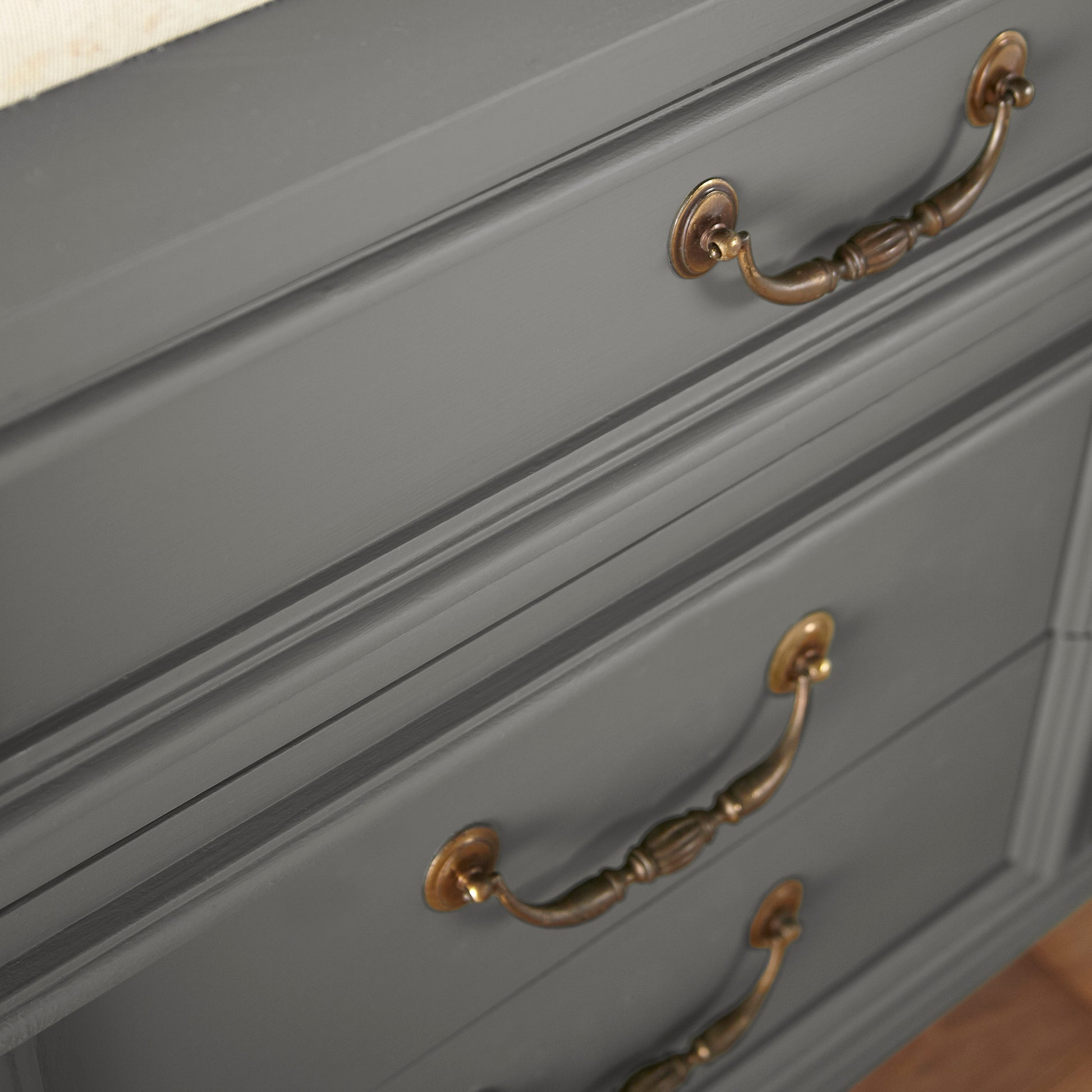Dark gray touched brown door and cabinet paint named salvaged shown painted on cabinet