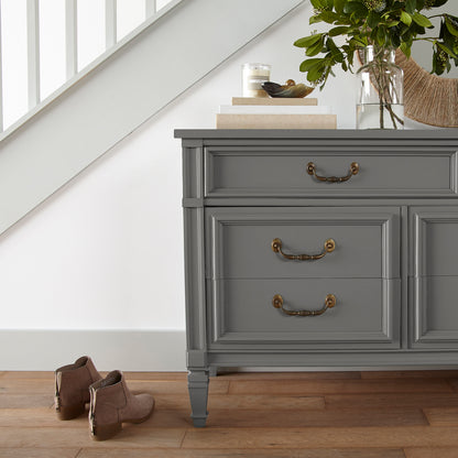 Dark gray touched brown door and cabinet paint named salvaged shown painted on entryway cabinet