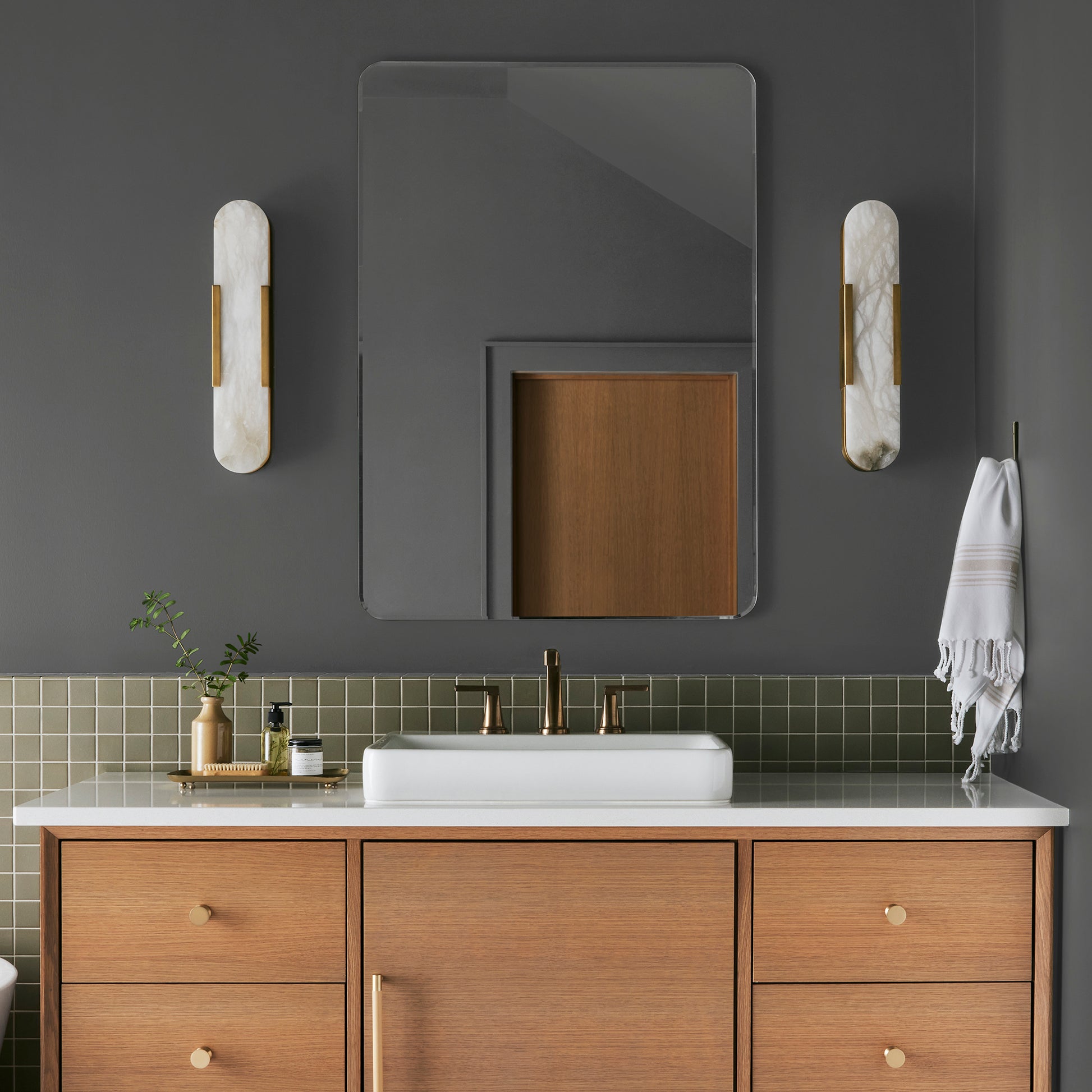 Almost black with green undertones interior paint named prairie smoke shown painted on bathroom wall