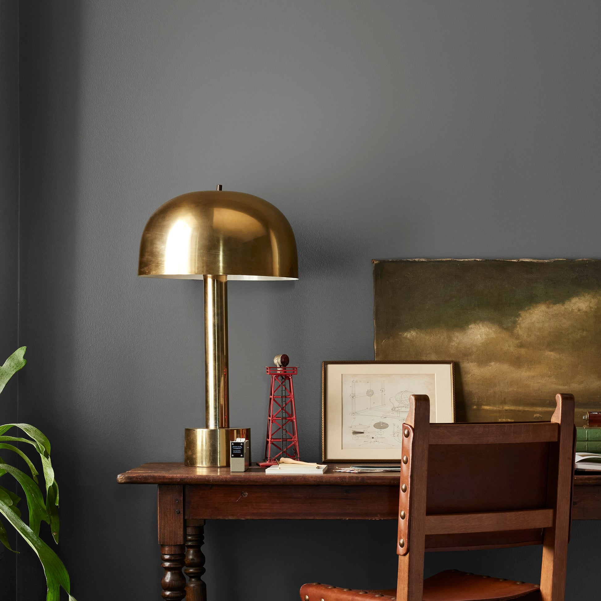 Almost black with green undertones interior paint named prairie smoke shown painted on bedroom wall