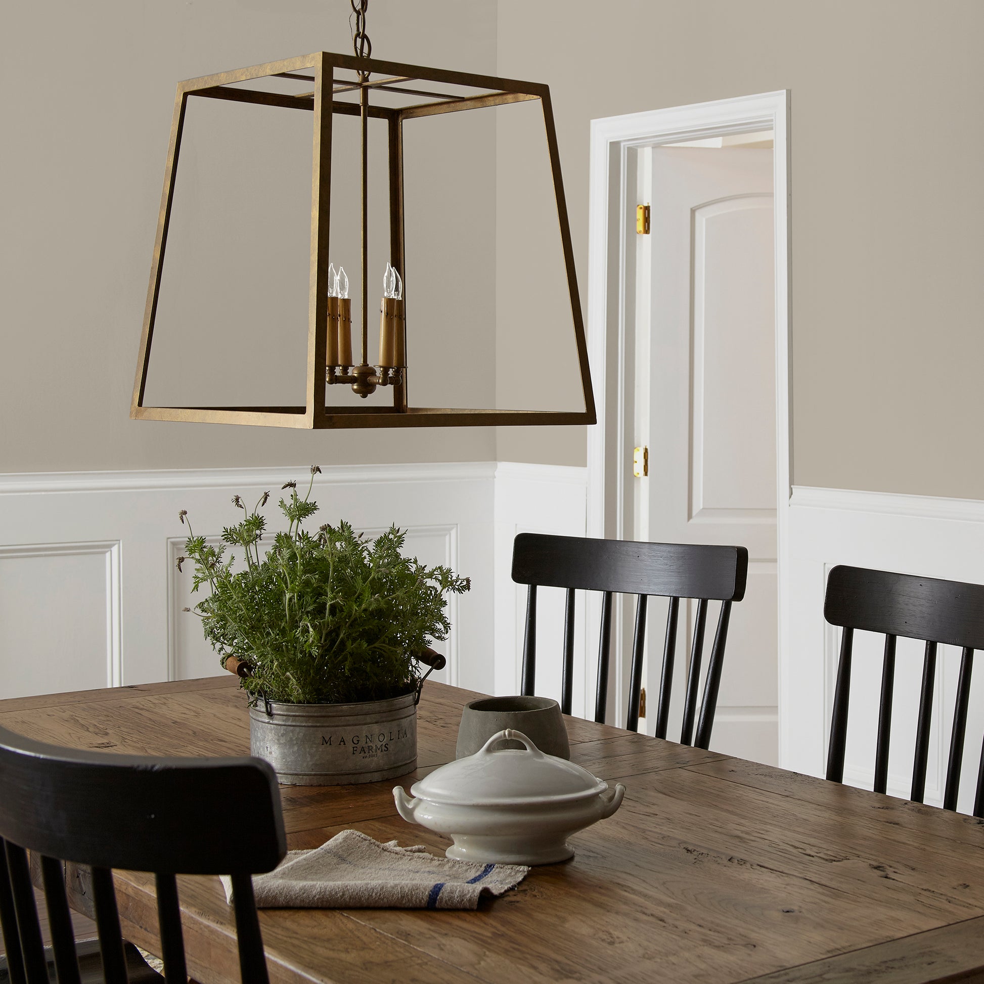 Soft french gray interior paint named Drawing Room shown painted on dining room wall