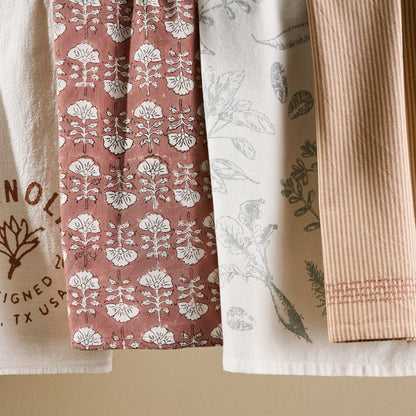 Flora Desert Clay Printed Tea Towel with other tea towels