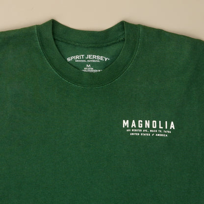 Magnolia Green Spirit Jersey close up front view of front pocket logo