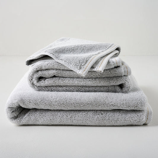 Magnolia Grey Plush Stitched Edge Towels shown stacked