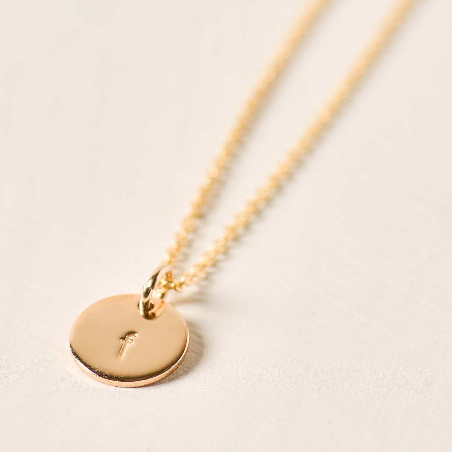 magnolia gold initial disc necklace