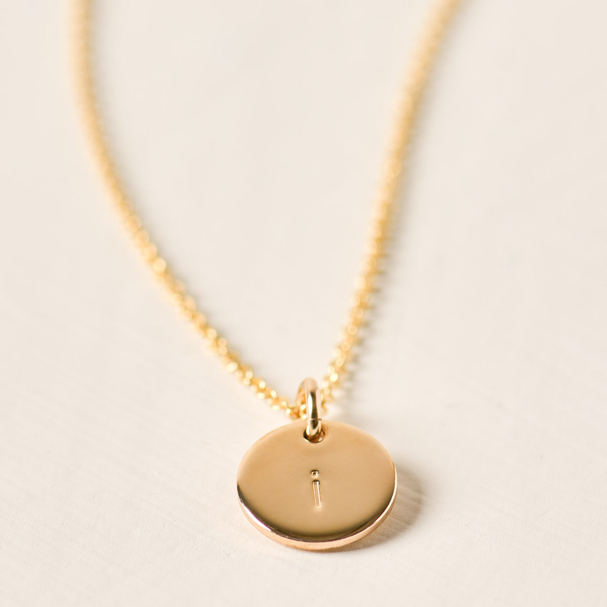 magnolia gold initial disc necklace