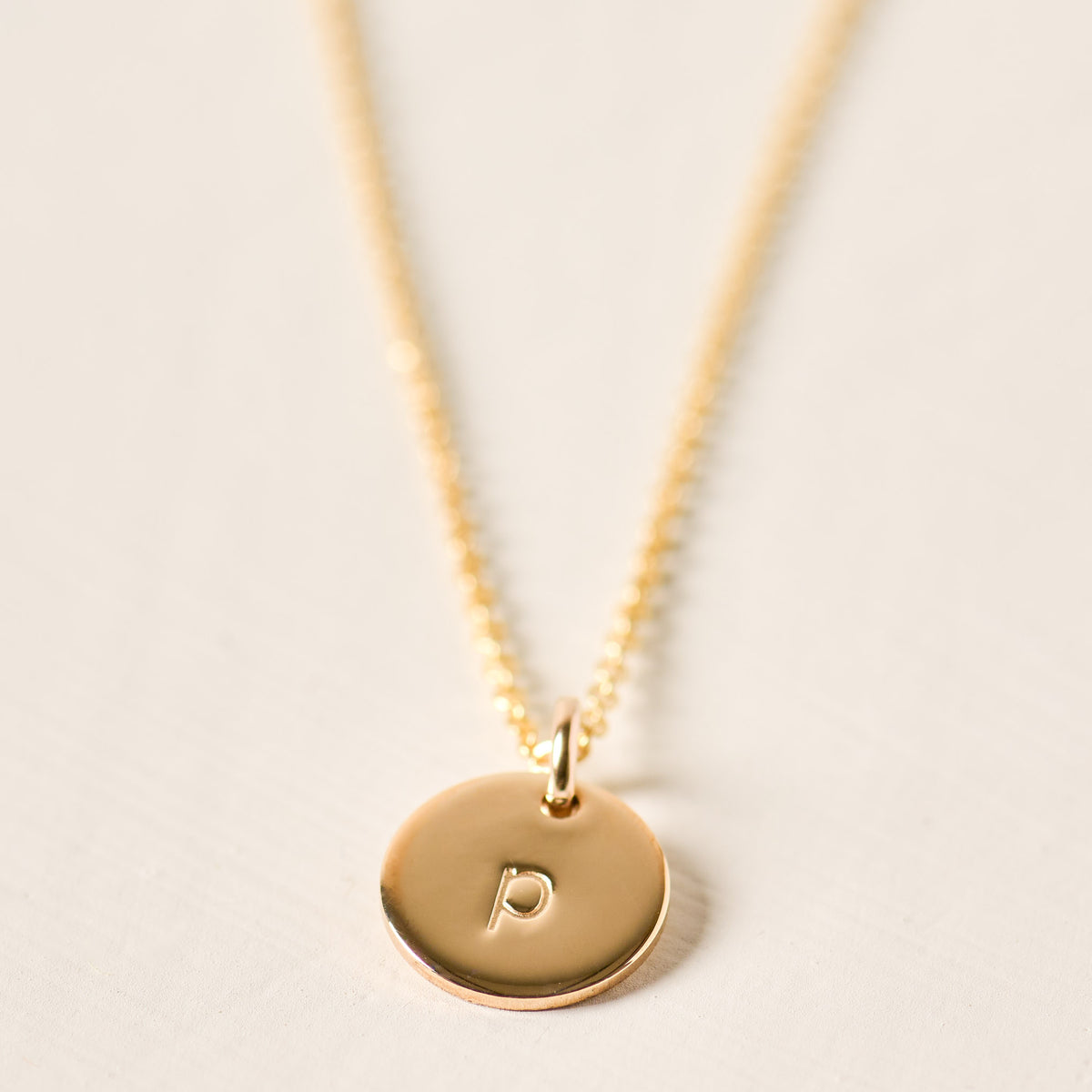 magnolia gold initial disc necklace