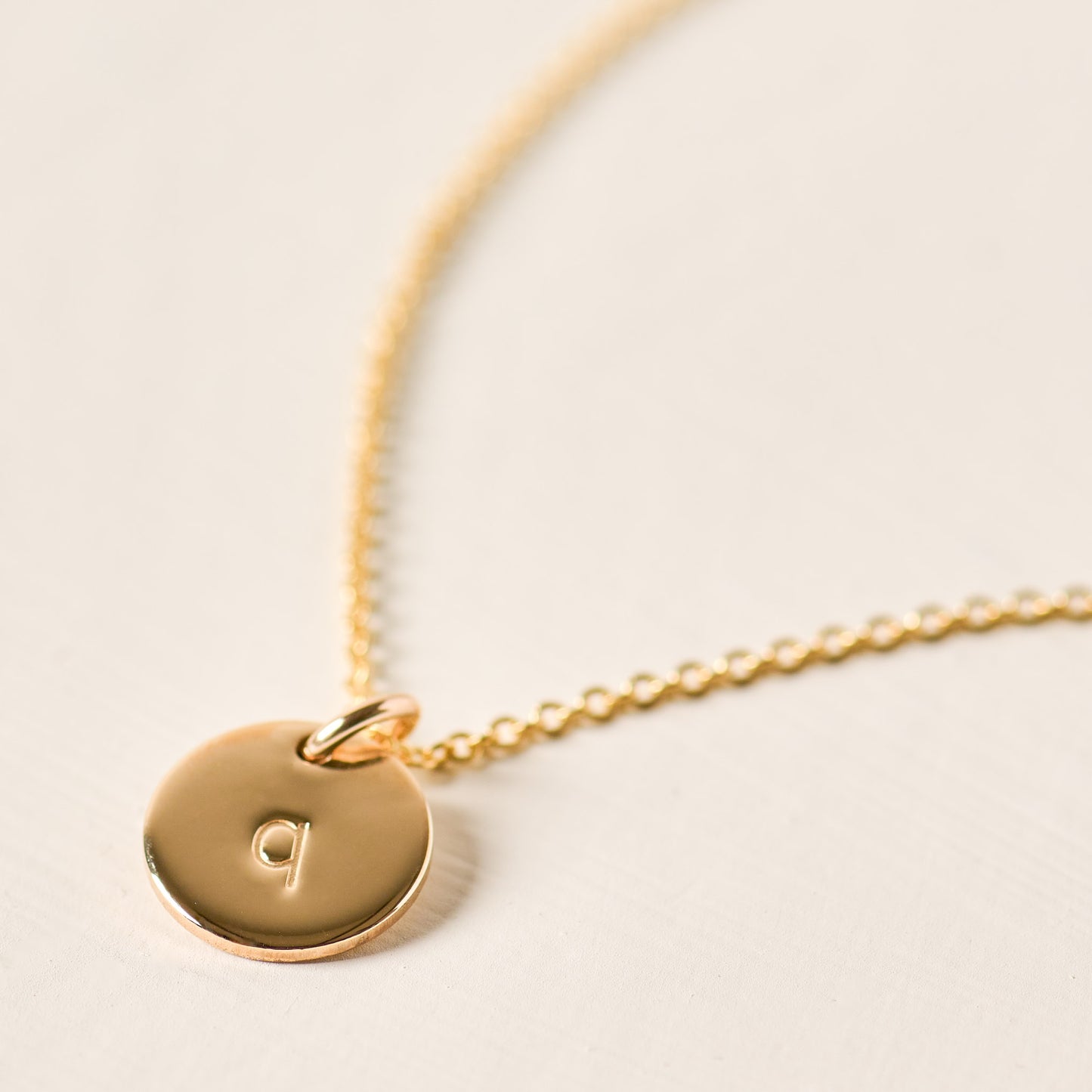 magnolia gold initial disc necklace