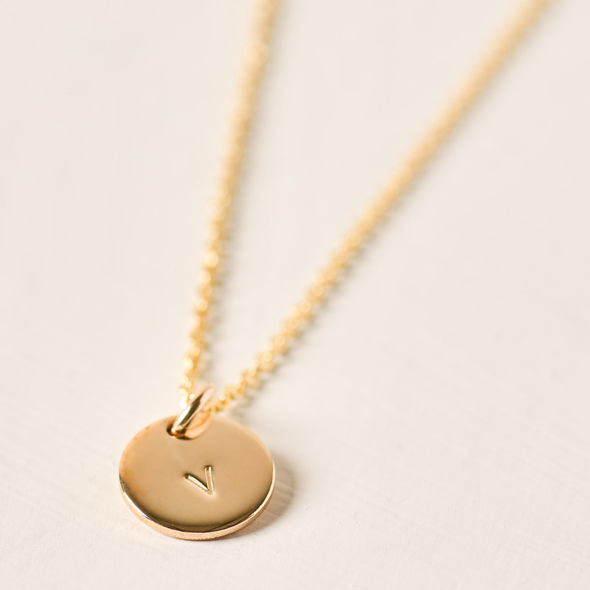 magnolia gold initial disc necklace