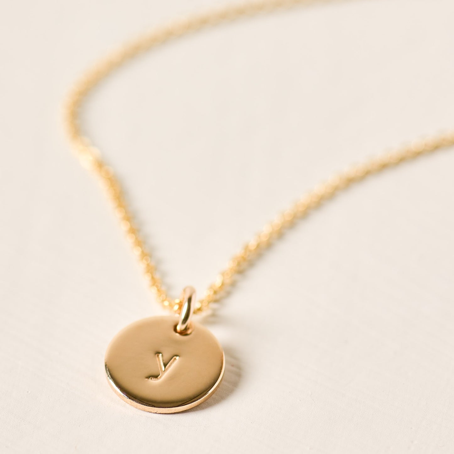 magnolia gold initial disc necklace