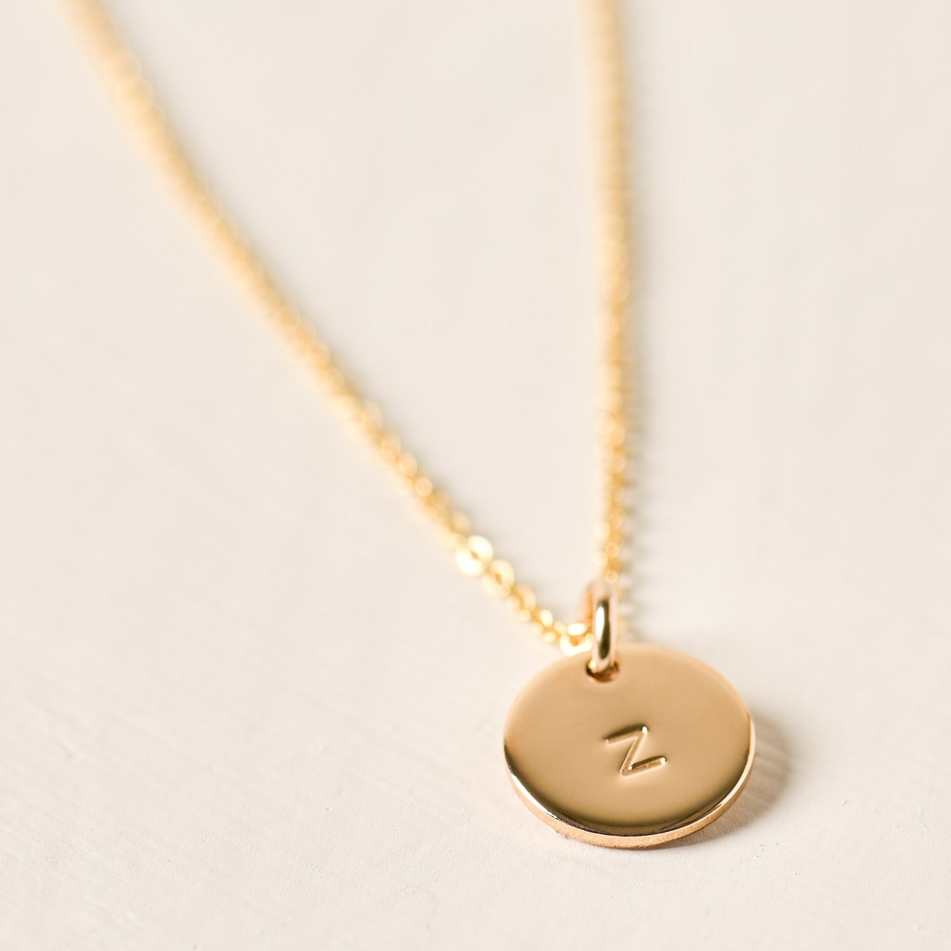 magnolia gold initial disc necklace