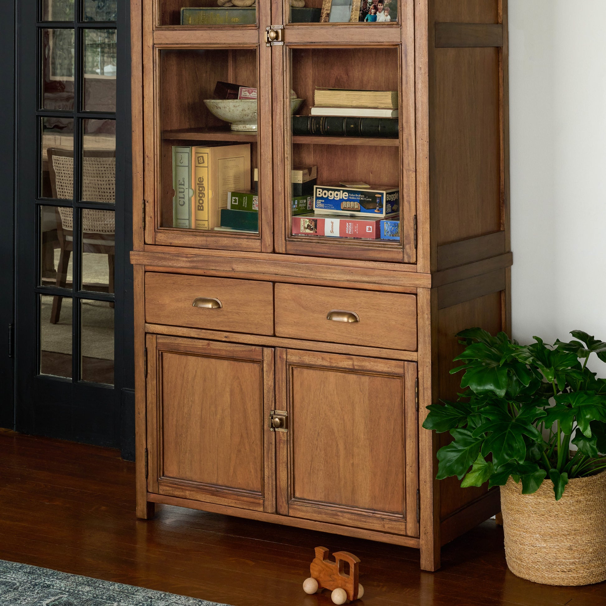 Hammond Cabinet in a room with doors closed and games and books inside