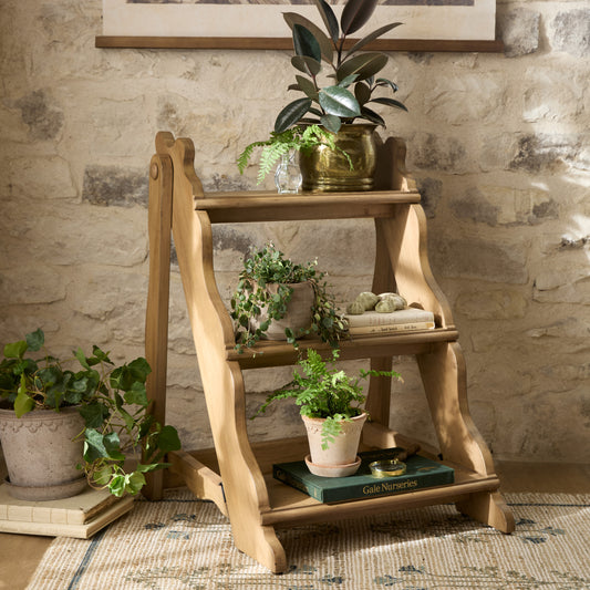 Vintage Inspired Plant Stand in a room with potted plants on each step