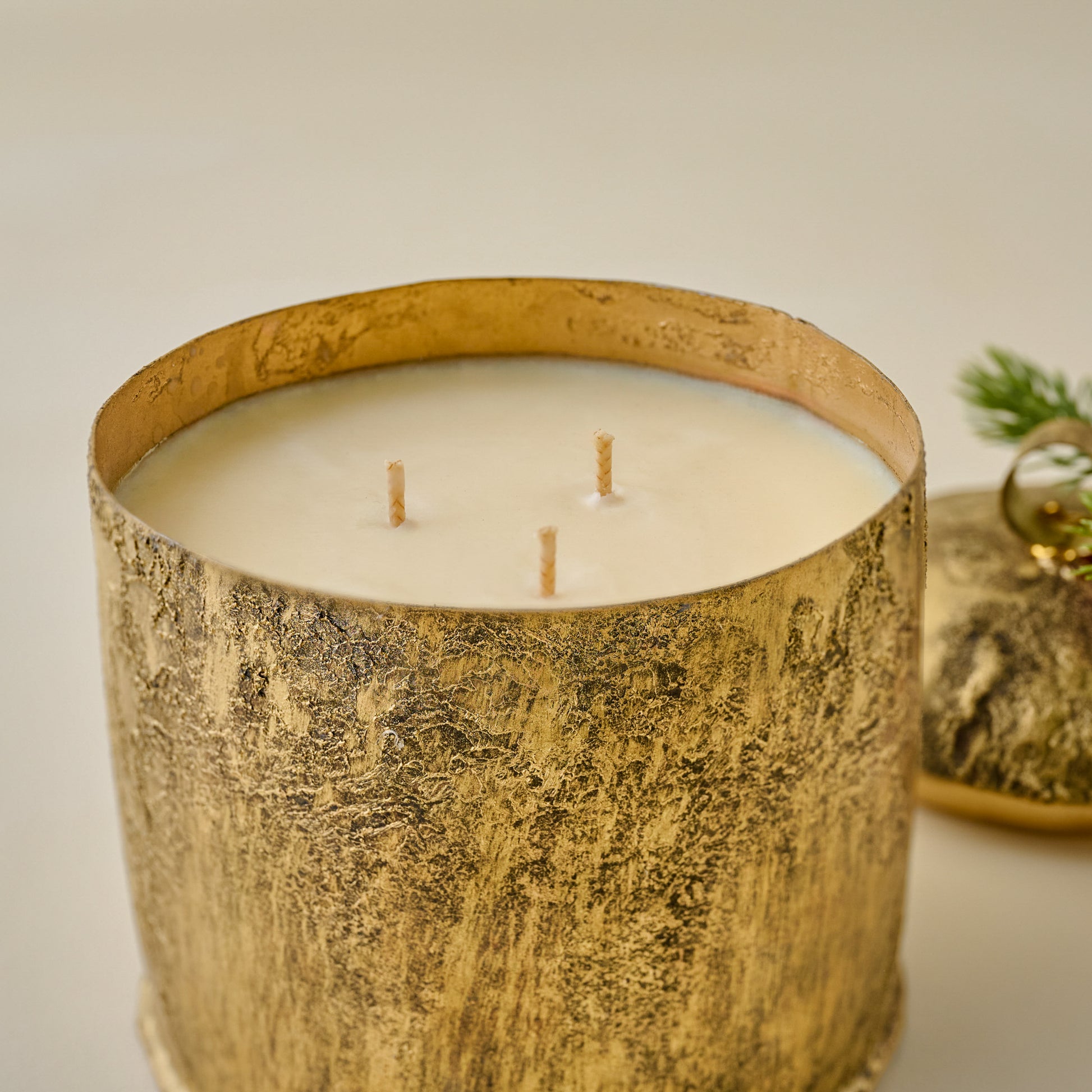 Aged Brass Yuletide Spice Bell Candle shown with lid off up close