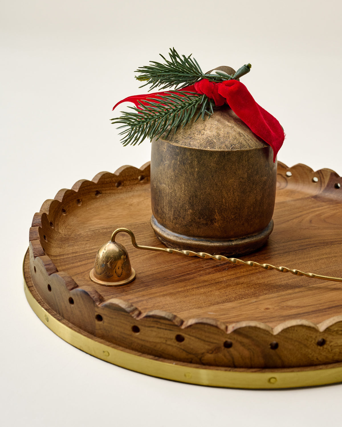 Magnolia Antique Brass Bell Candle on wood tray with snuffer