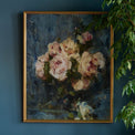 Still Life with Roses in a Glass Vase hanging on a blue wall above a chair