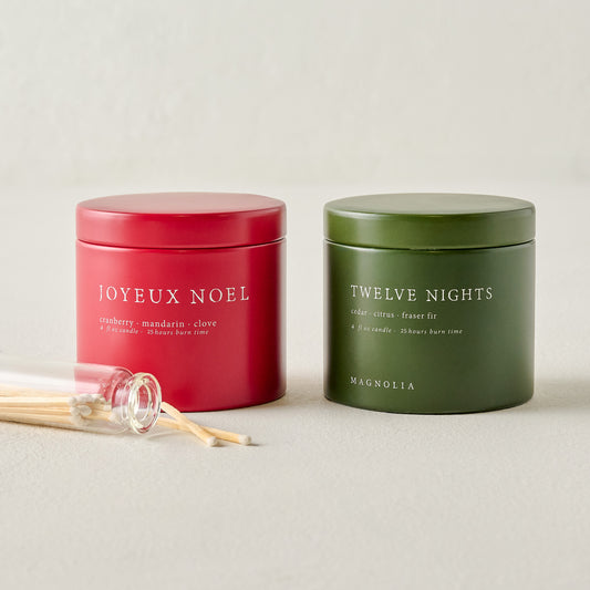 Magnolia Joyeux Noel and Twelve Nights Candle Tin Bundle shown with matches