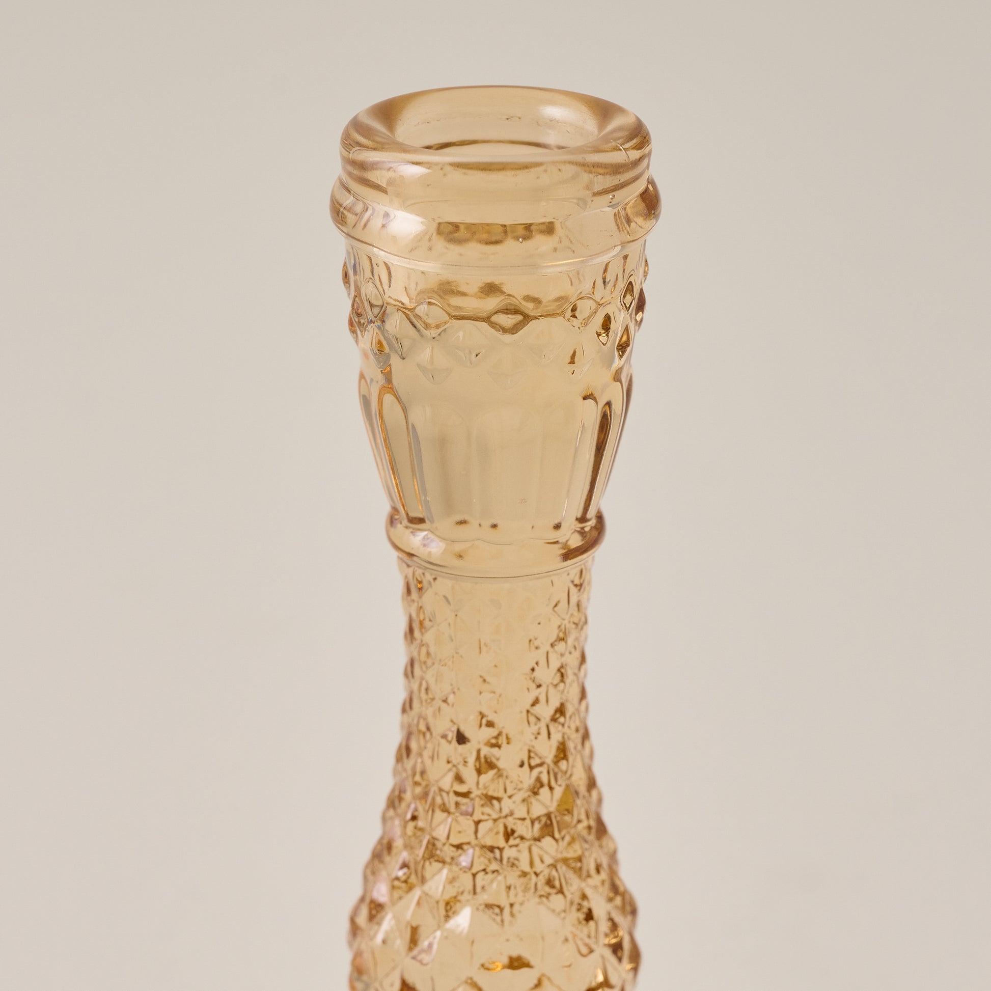 Antique Amber Glass Taper Holder up close