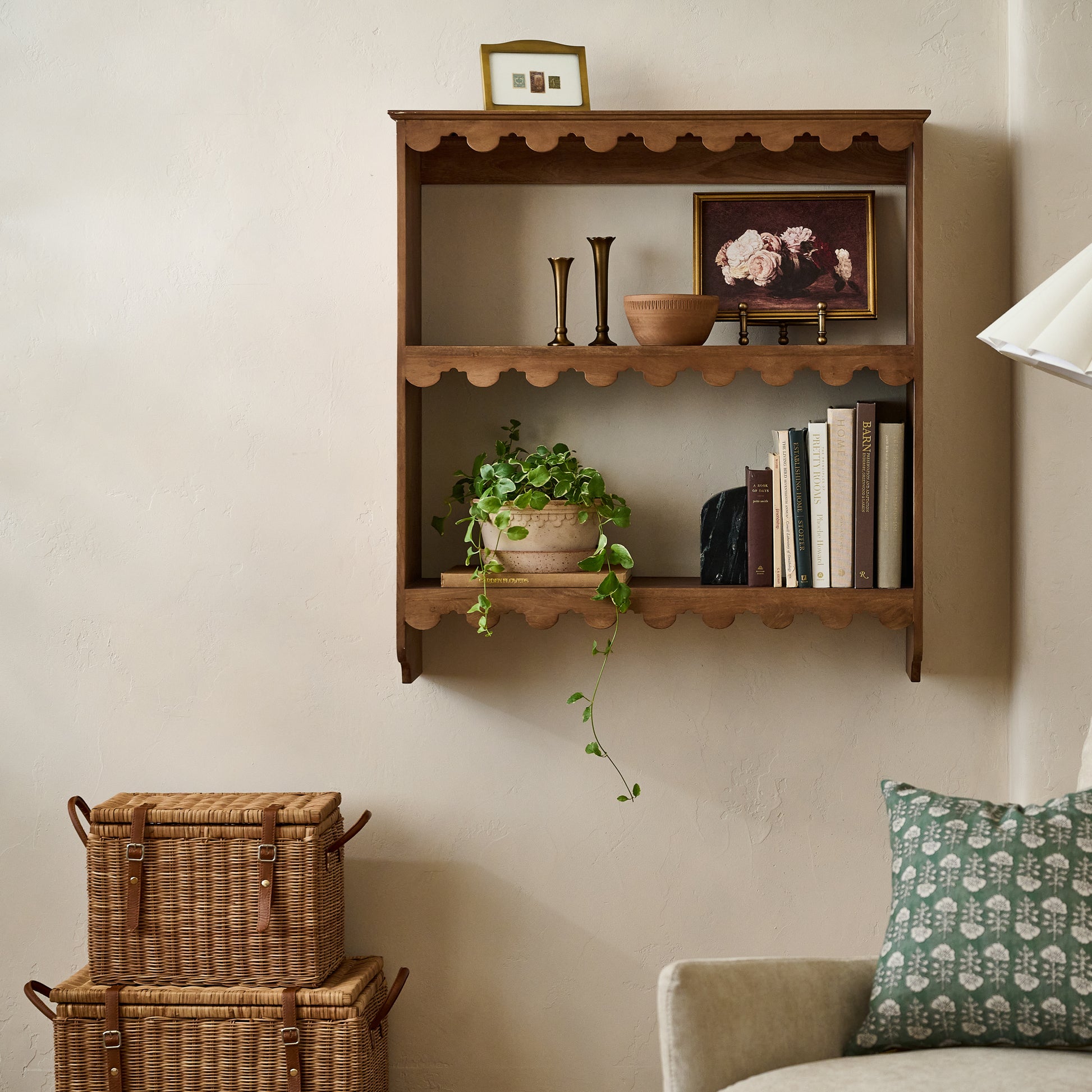 Reid Woven Storage Trunk with Leather Handles shown next to wall decor