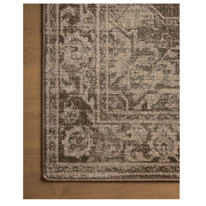 Mona Cocoa Stone Rug close up of rug corner on wood floor