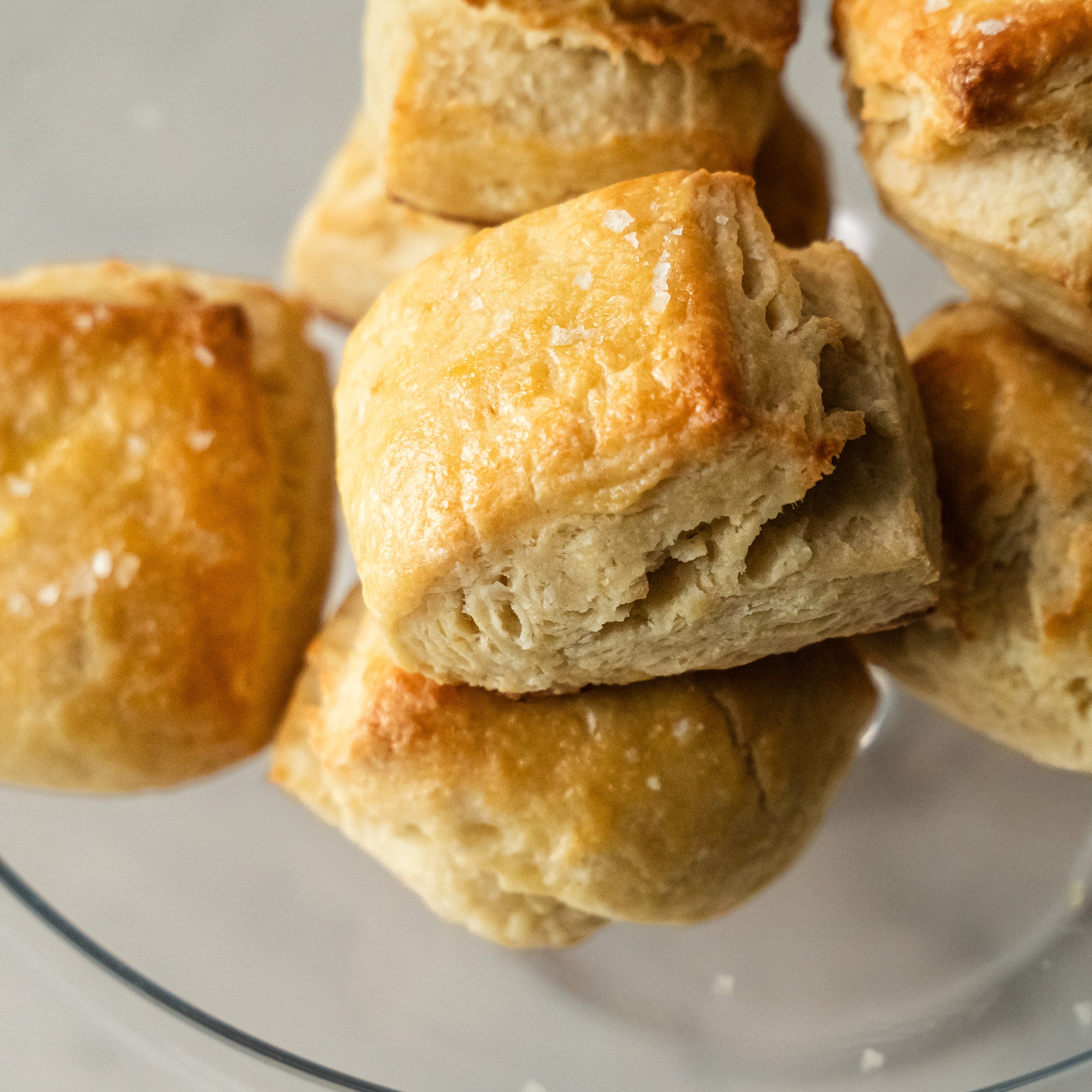 Close-up of golden brown biscuits on a white plate