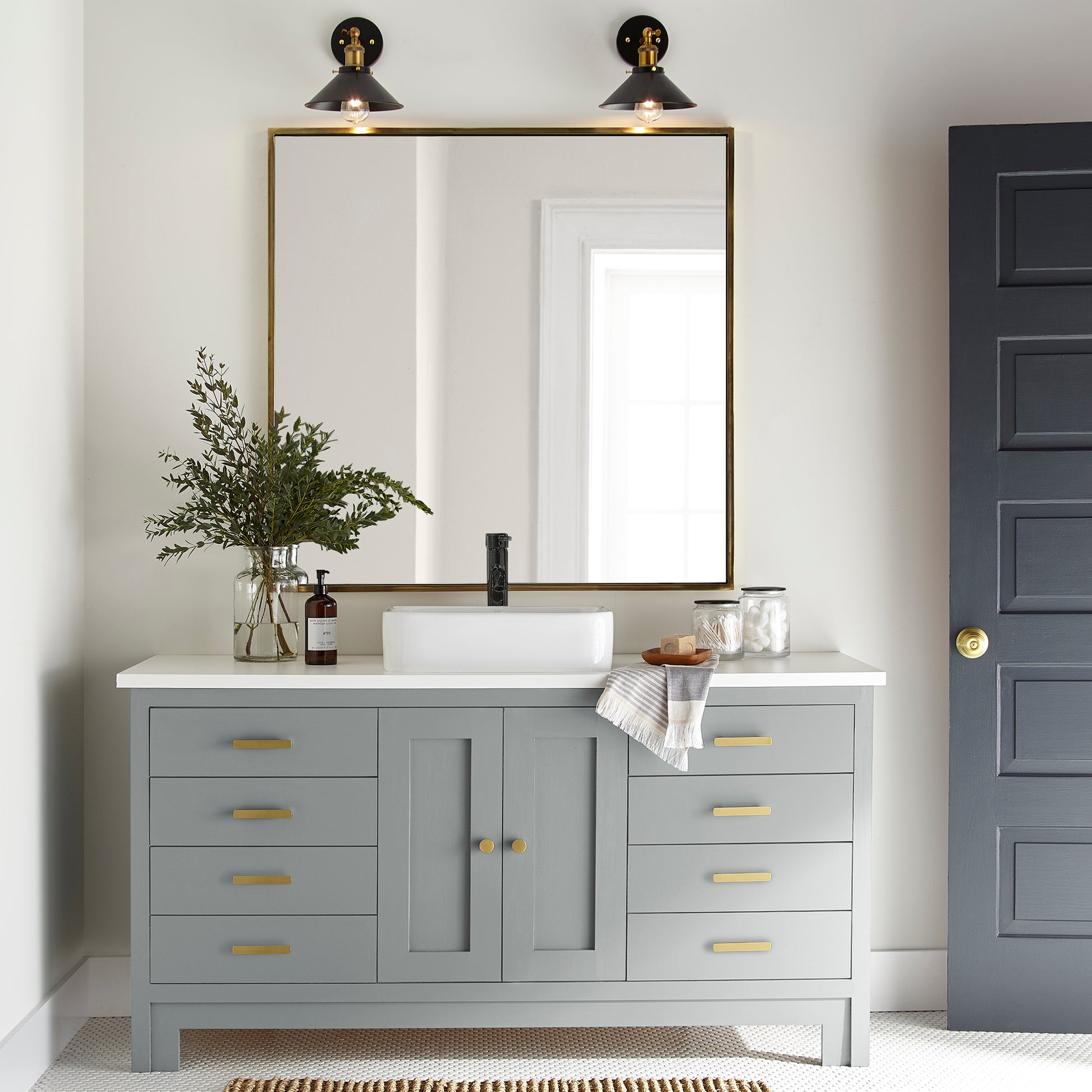 neutral grey with a tinge of blue paint color named tranquil waters shown painted on bathroom cabinet