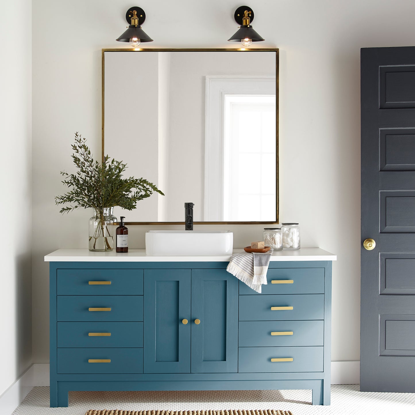 true blue paint color named superior shown painted on bathroom cabinets