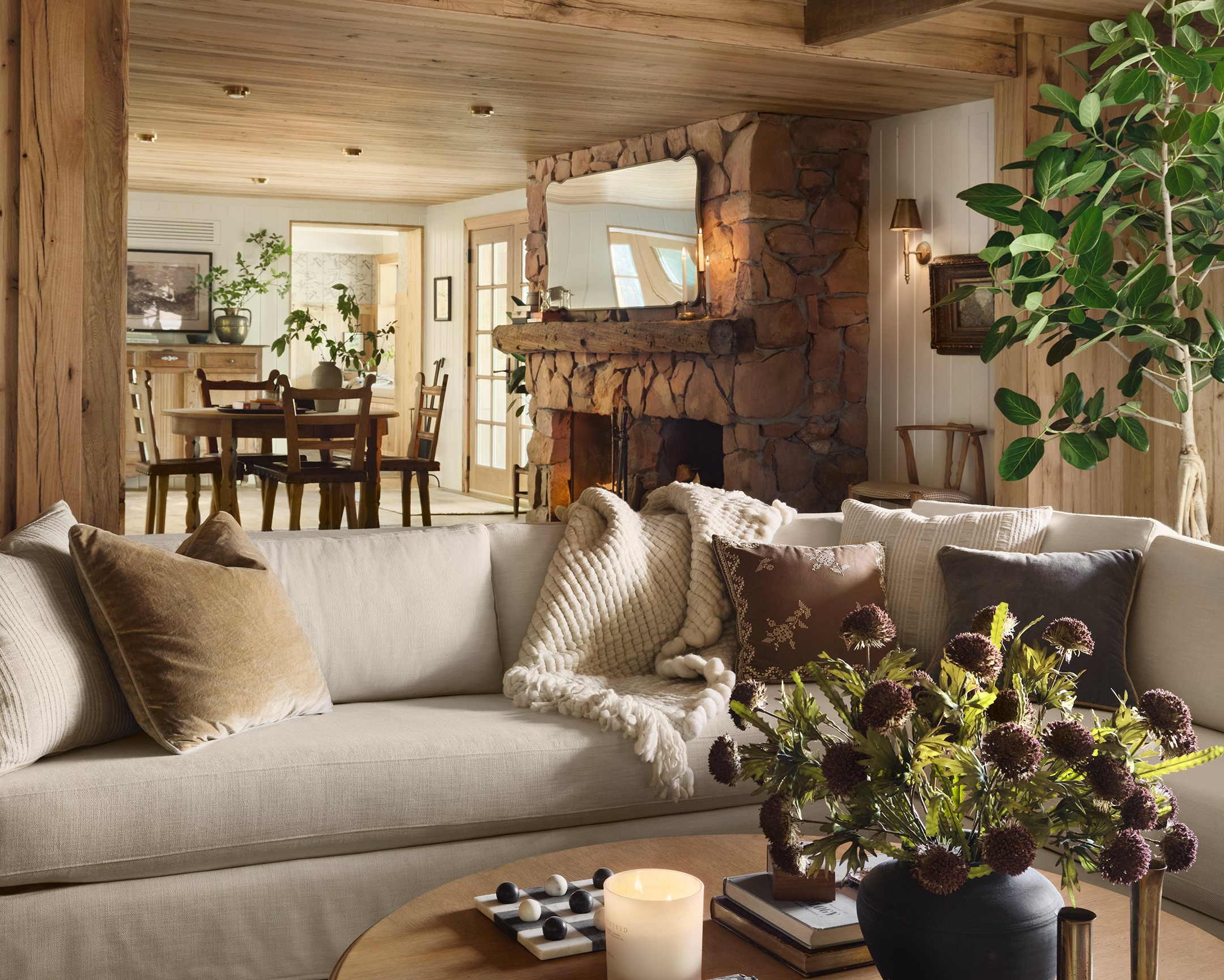 Cozy living room with a fireplace, sofa, and decorative elements.