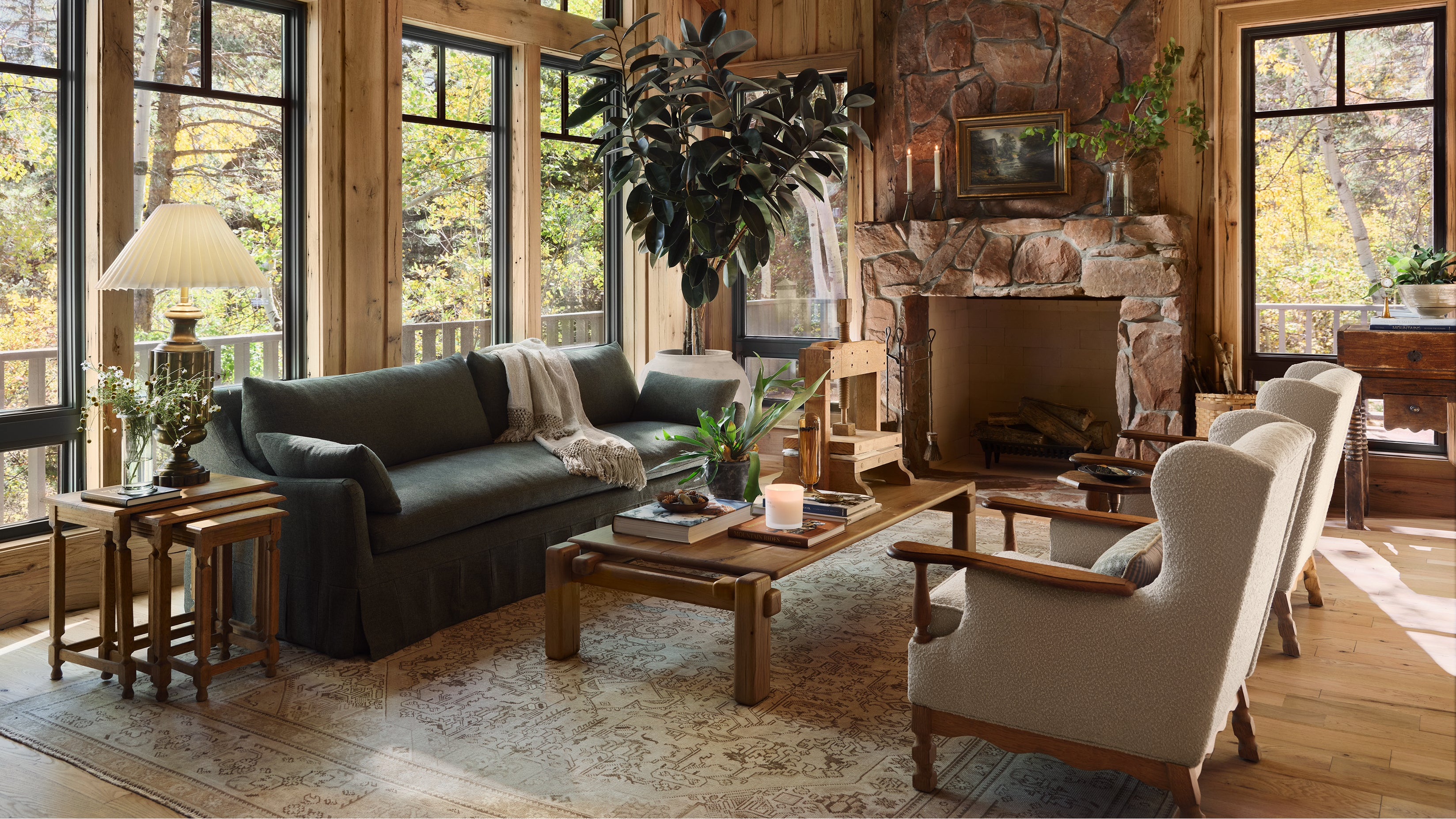 Cozy living room with a fireplace, gray sofa, and white armchair.