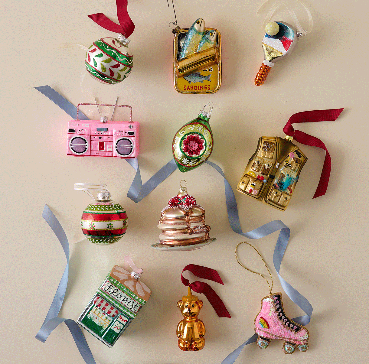 11 fun and nostalgic glass ornaments on a beige background