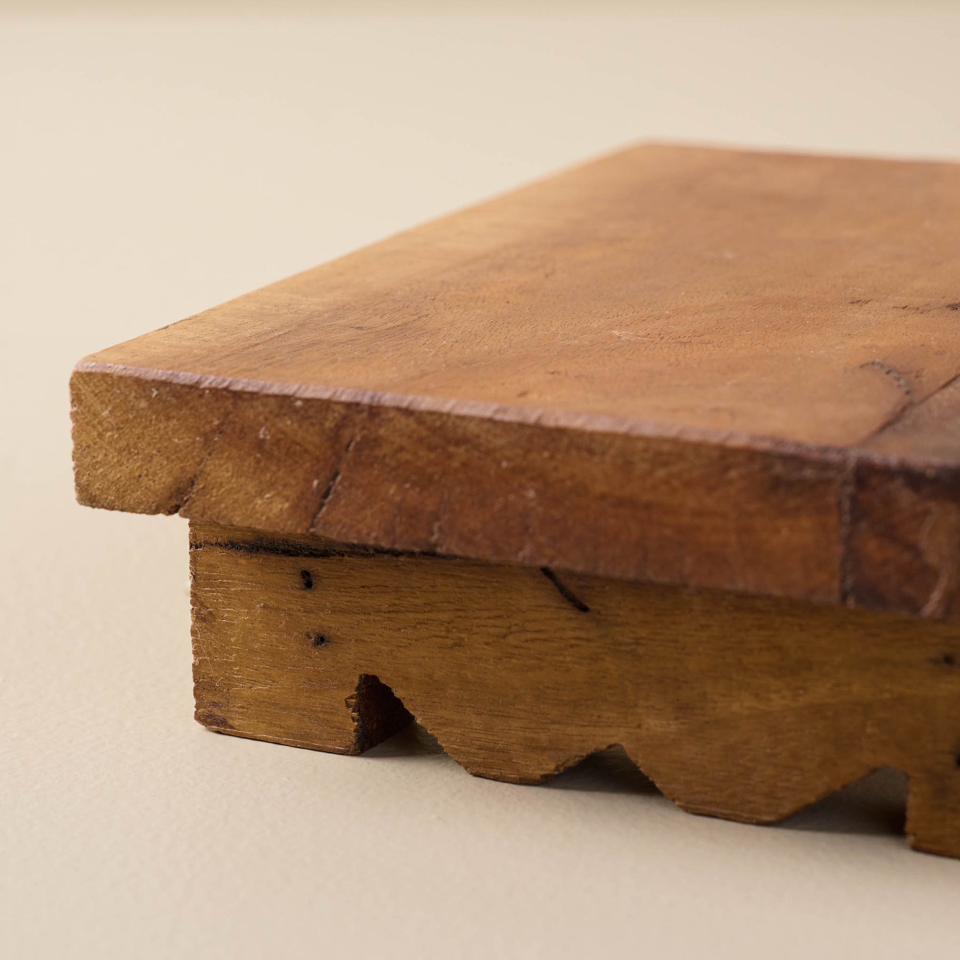 corner view of antiqued wooden riser