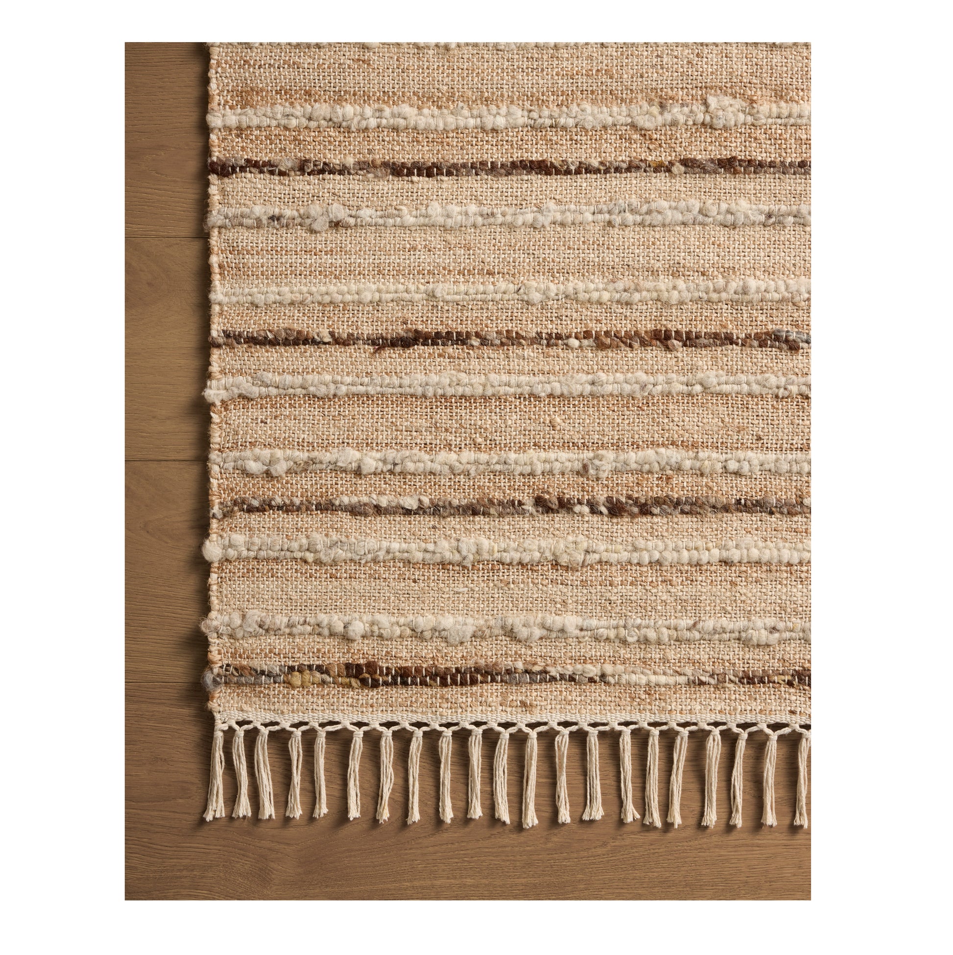 Nico Natural Bark Rug close up of corner on wood floor