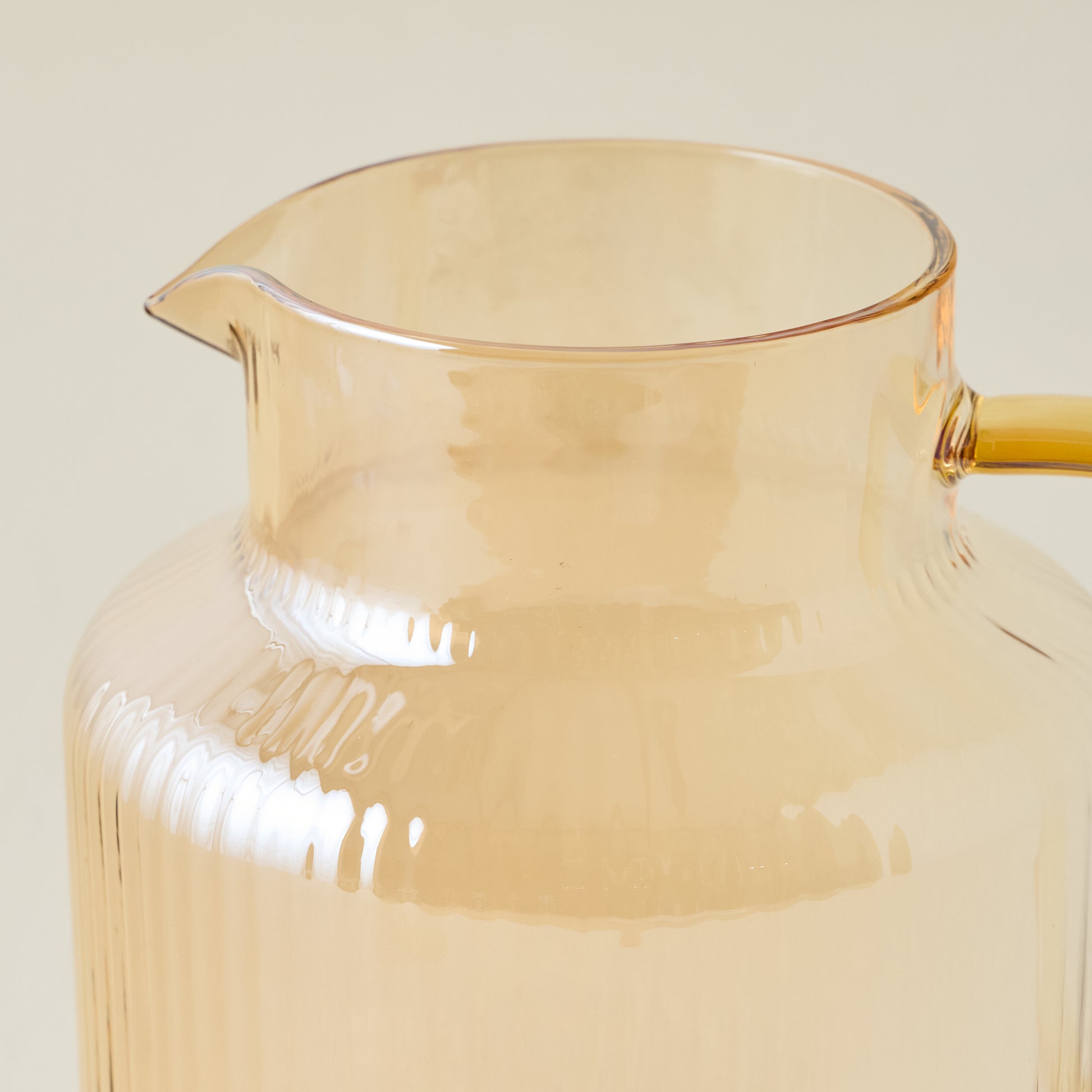 Peach Ribbed Glass Pitcher up close