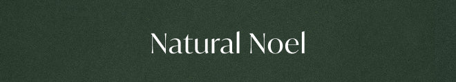The text 'Natural Noel' in white serif lettering centered on a dark textured green background.