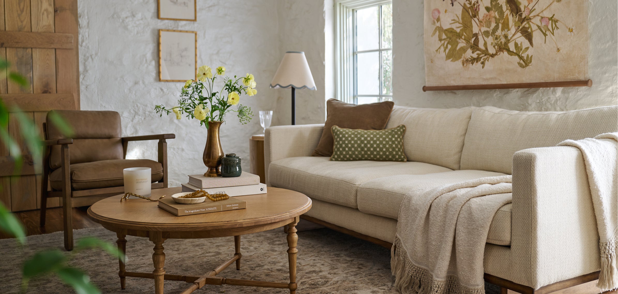 Cozy living room with beige sofa, wooden coffee table, and decorative elements.