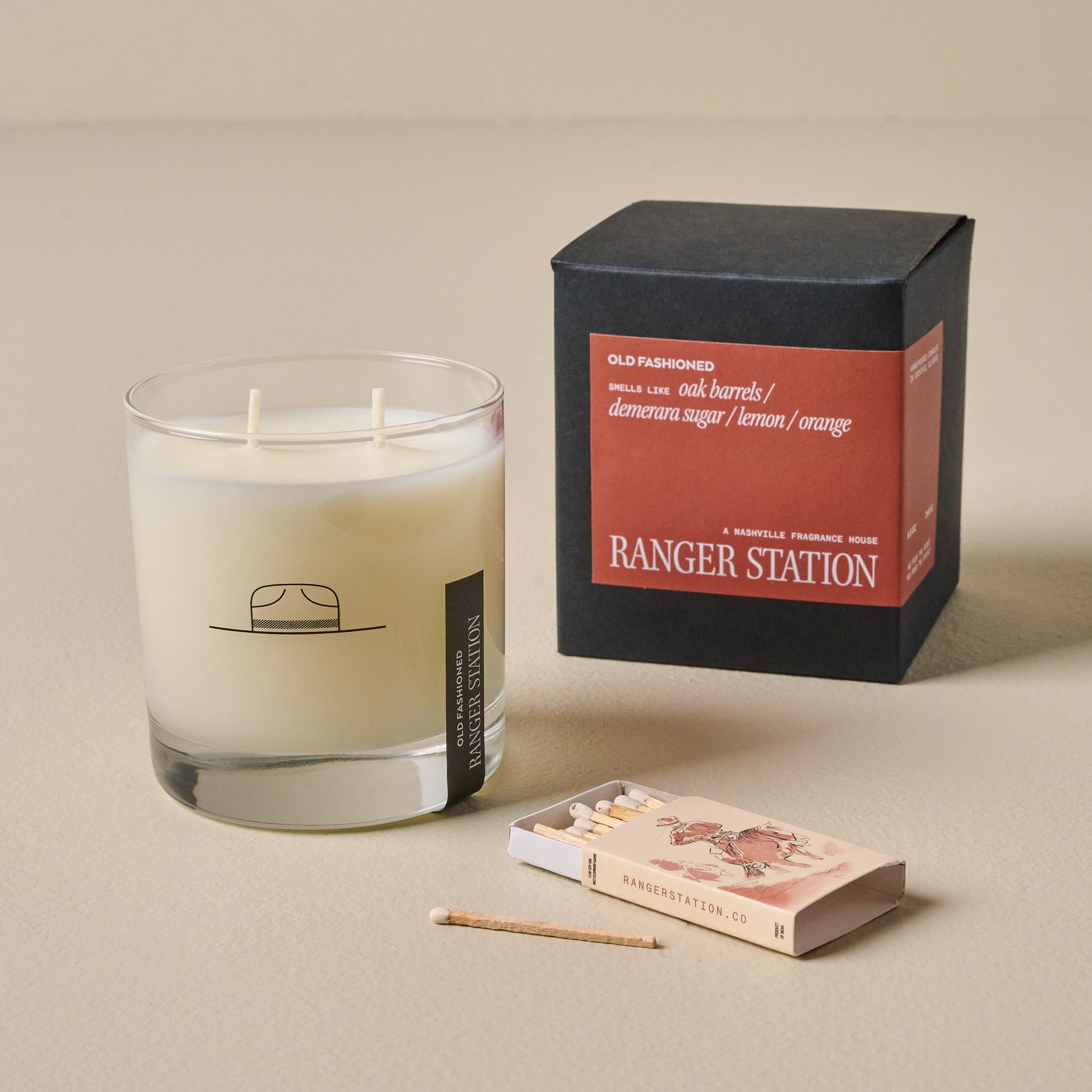 Ranger Station Old Fashioned Candle shown with packaging box and matchbox