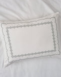 Daphne Cross-Stitch Sham queen/king shown on bed