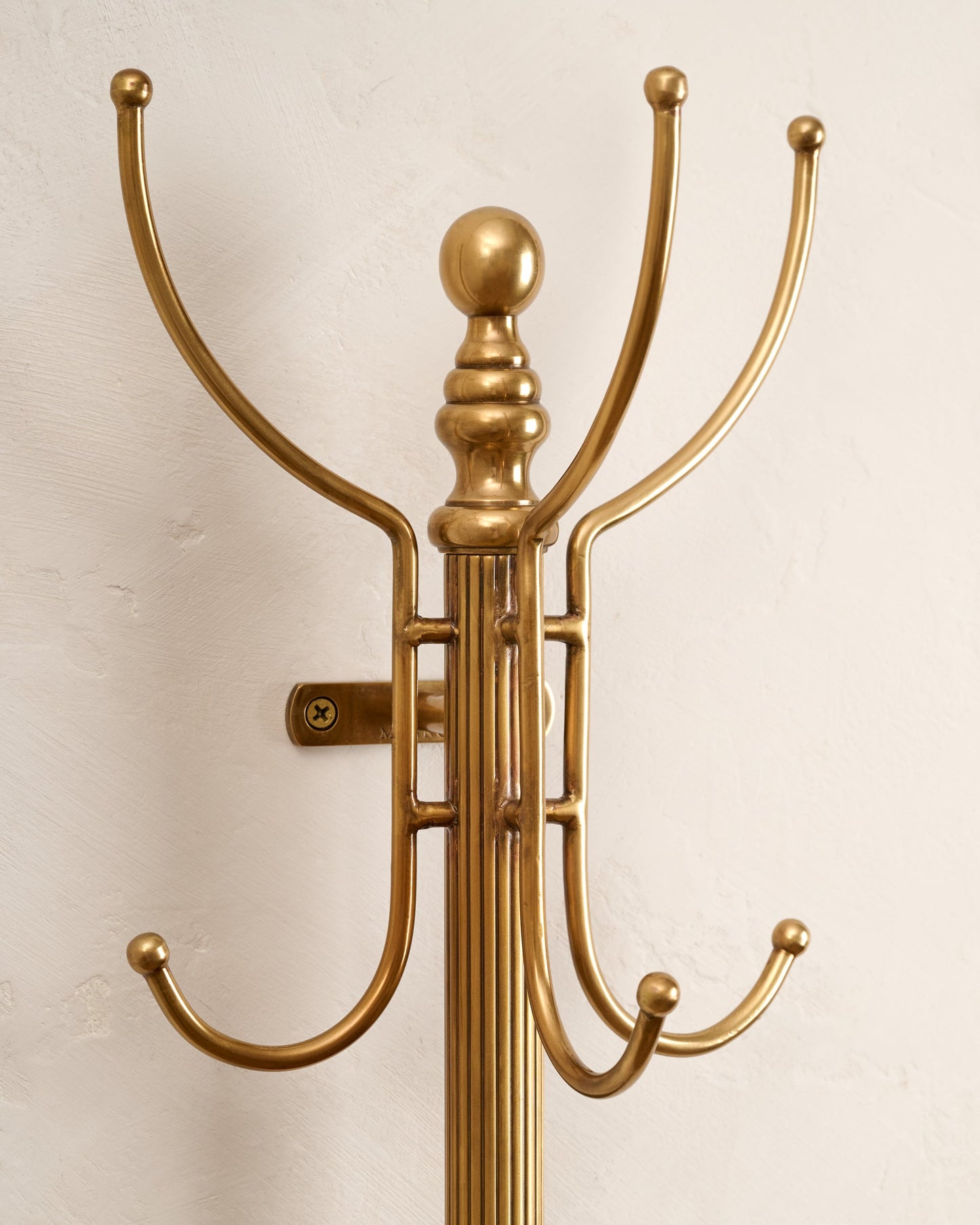 Antique Inspired Brass Coat Rack up close