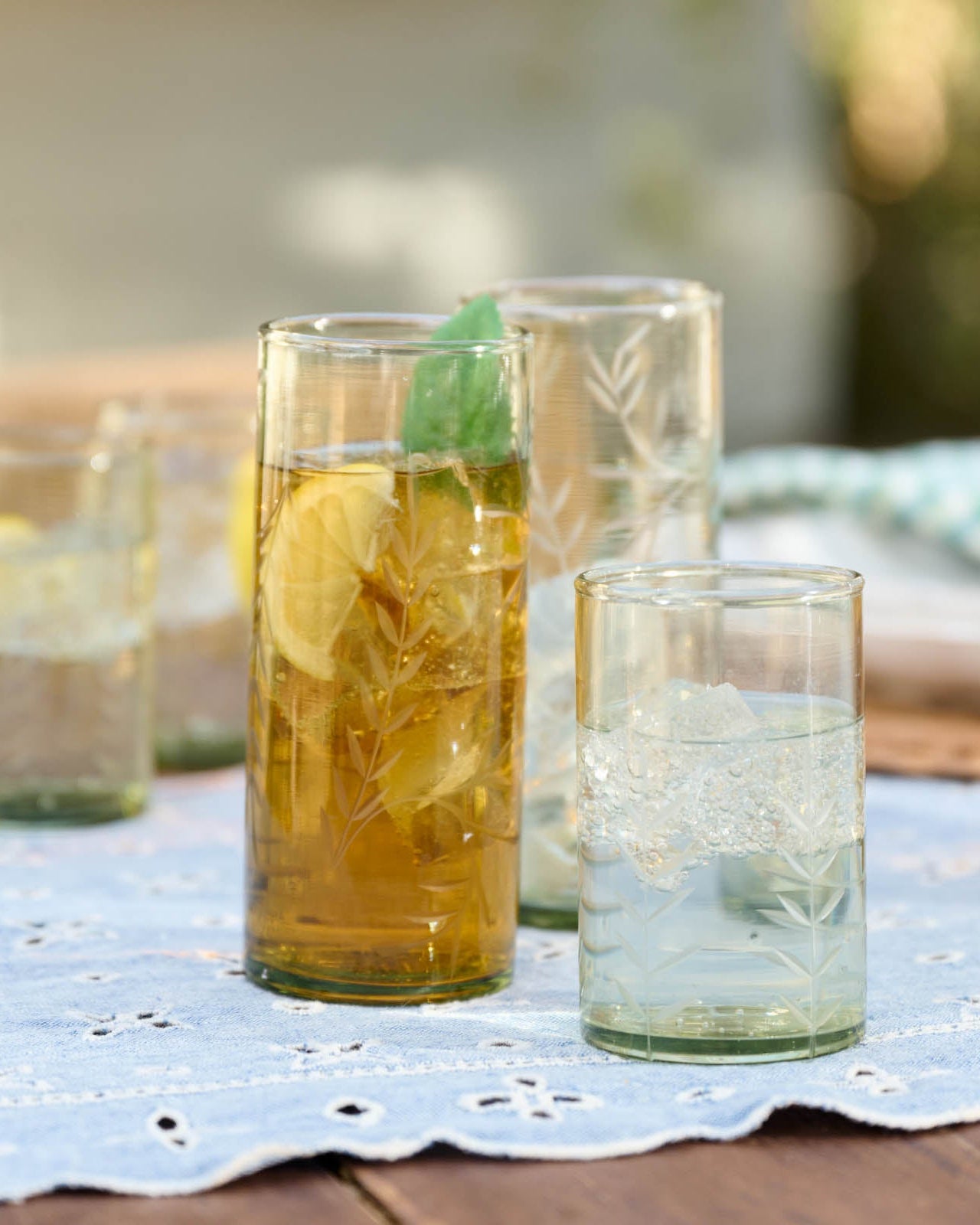Recycled Etched Glass Tumbler, Green on outside table with drinks 